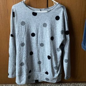 Soft polkadot long sleeve shirt. Large neckline and longer at the bottom.